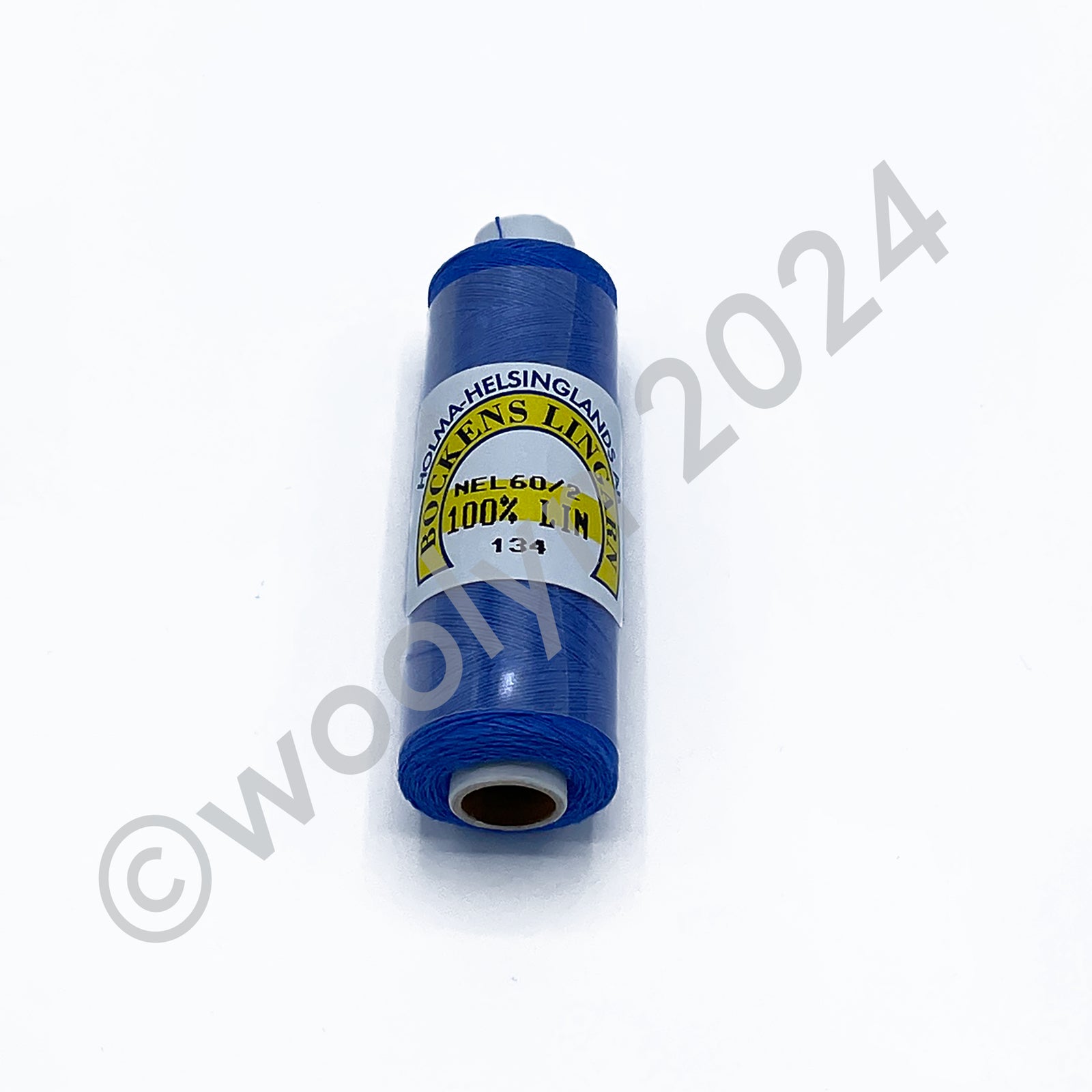 A 12.5g spool of Bockens Bobbin Lace Thread in 134 medium blue.