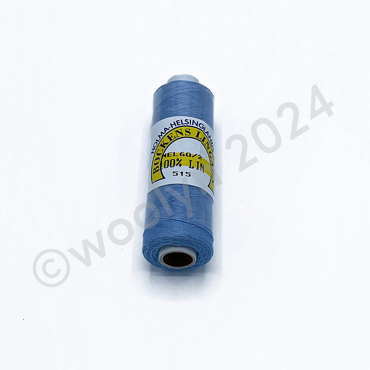 A 12.5g spool of Bockens Bobbin Lace Thread in 515 Light Blue.