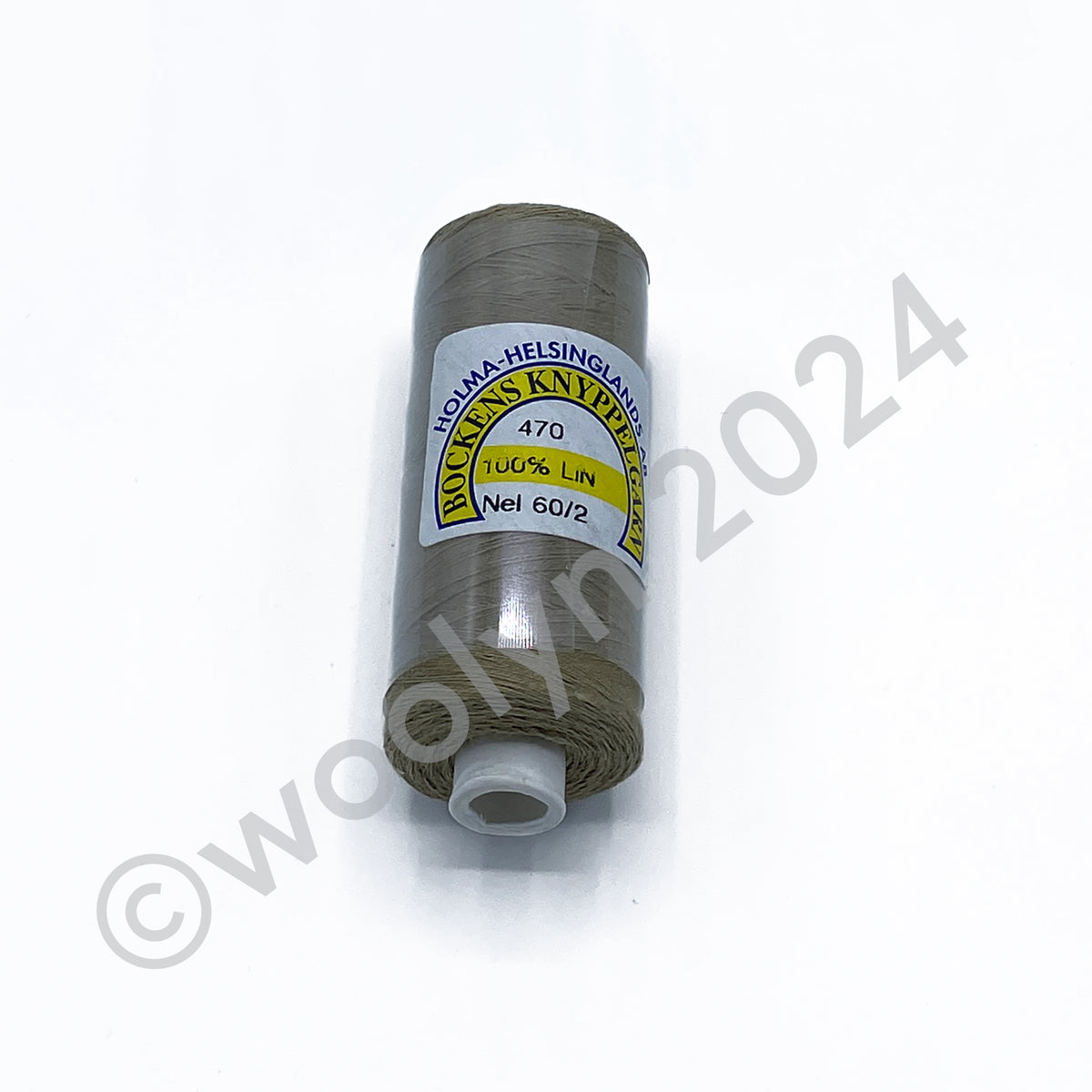 A 25g spool of Bockens Bobbin Lace Thread in natural brown.