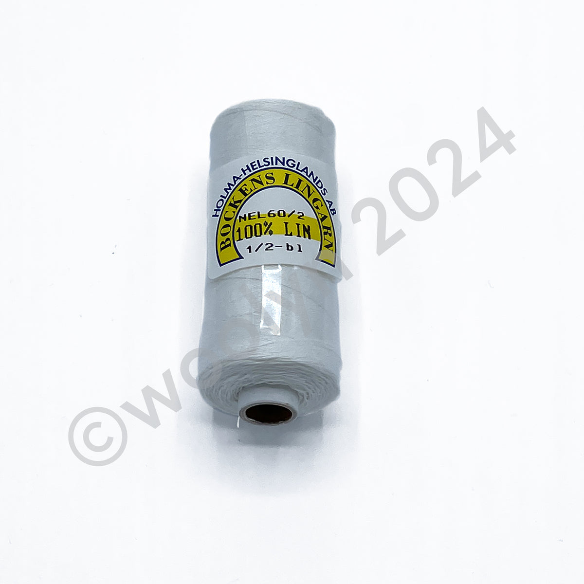 A 25g spool of Bockens Bobbin Lace Thread in half bleached white.
