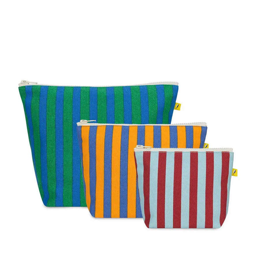 A set of three zippered pouches, a large blue and green striped pouch, a medium blue and orange striped pouch, and a small red and light blue striped pouch on a white background