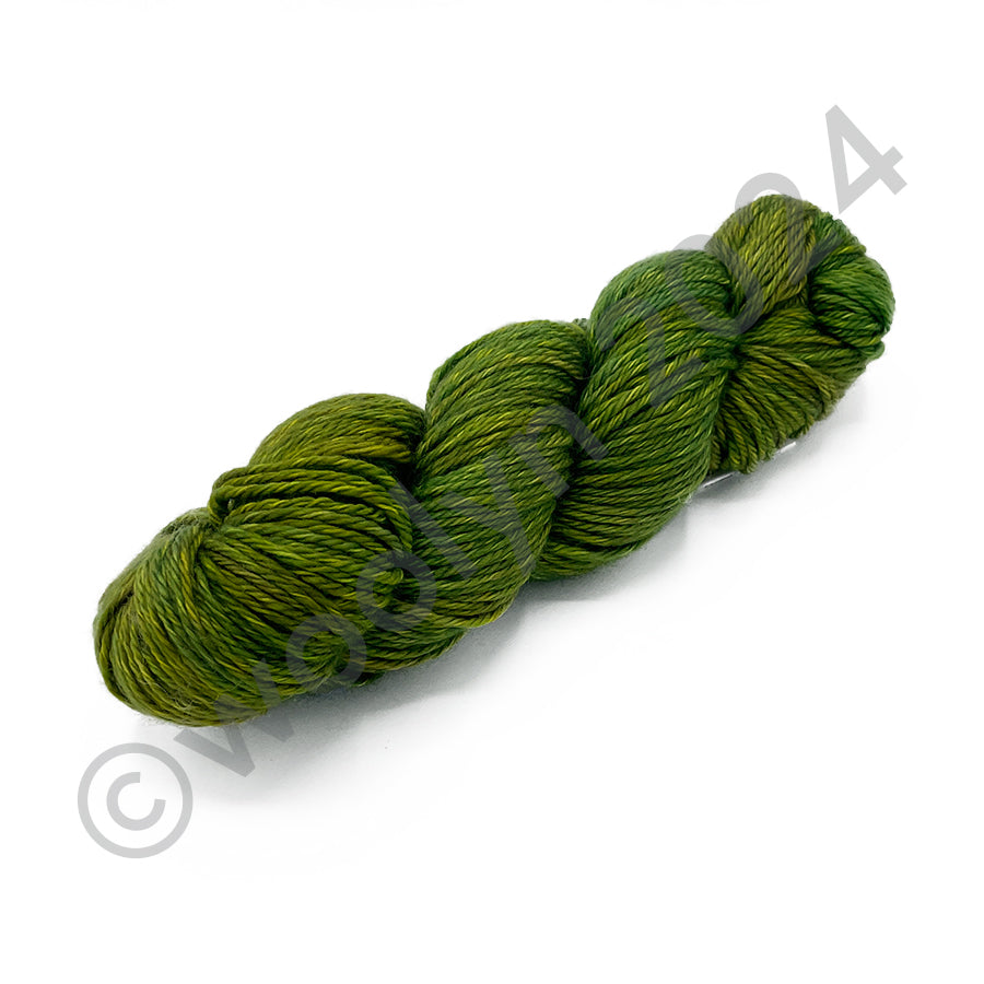 A skein of Percheron Babolina in a mossy green with  yellow accents