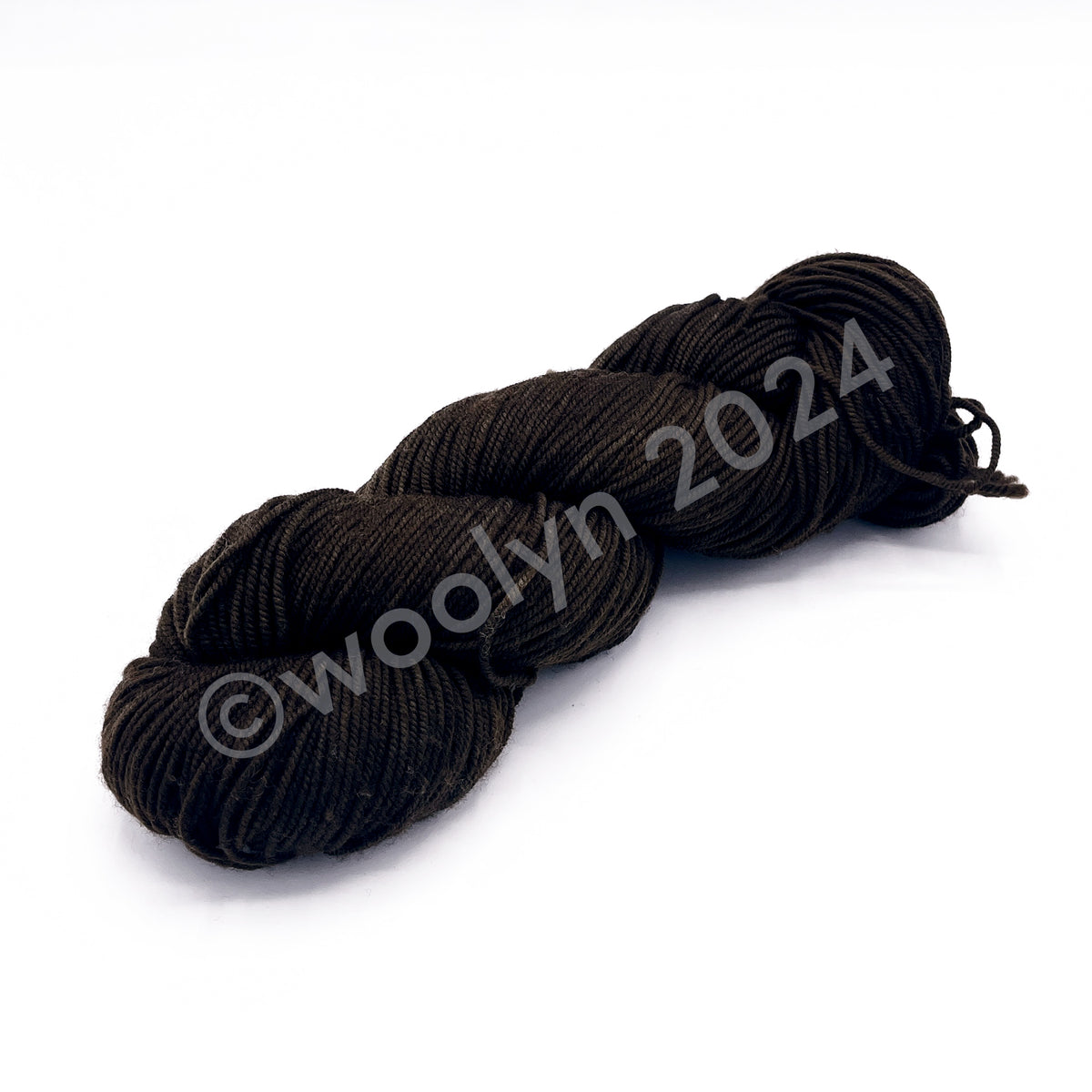 A Skein of Knitted Wit DK Brown Sugar, a dark brown 