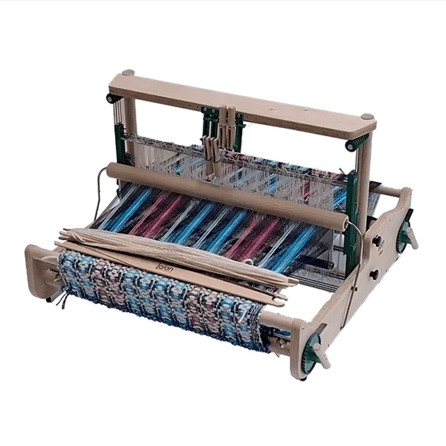 Wooden Lojan Flex loom with 4-shaft attachment, stick shuttles, and a colorful weaving project