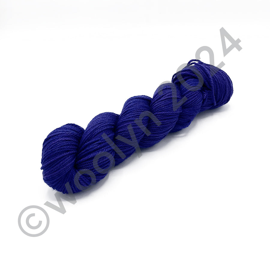 Skein of Tesserae Kissa in Hadley, a vibrant violet purple color