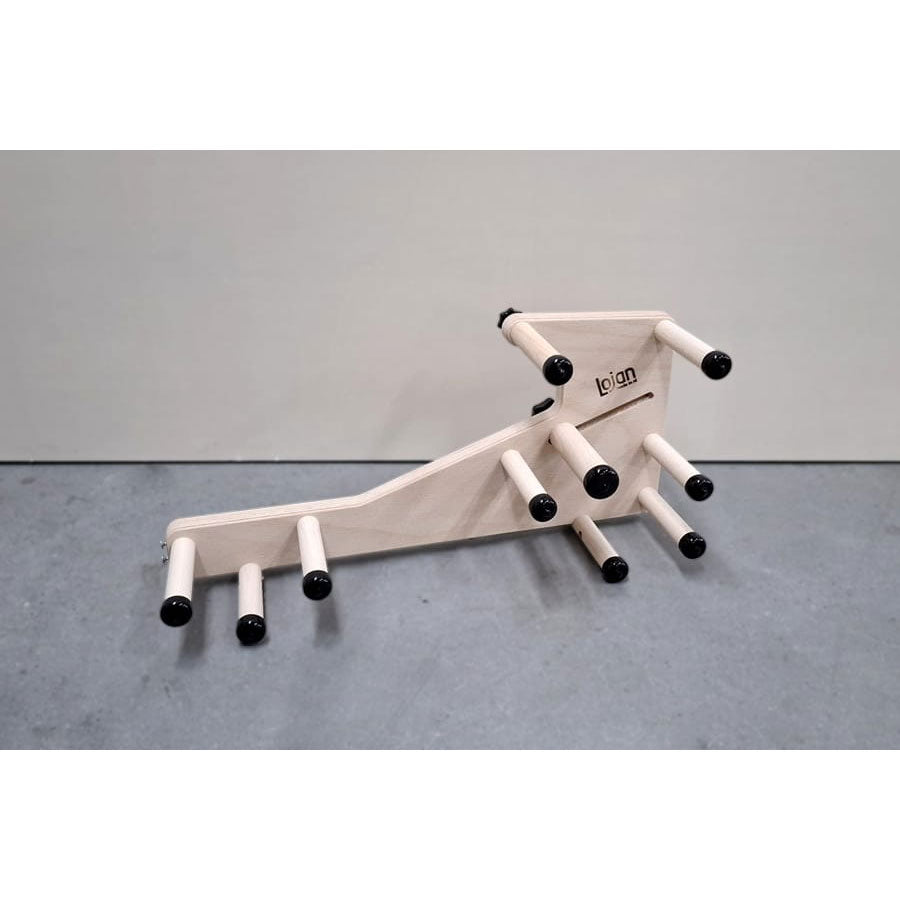 Side view of the wooden Lojan inklette loom on a gray table