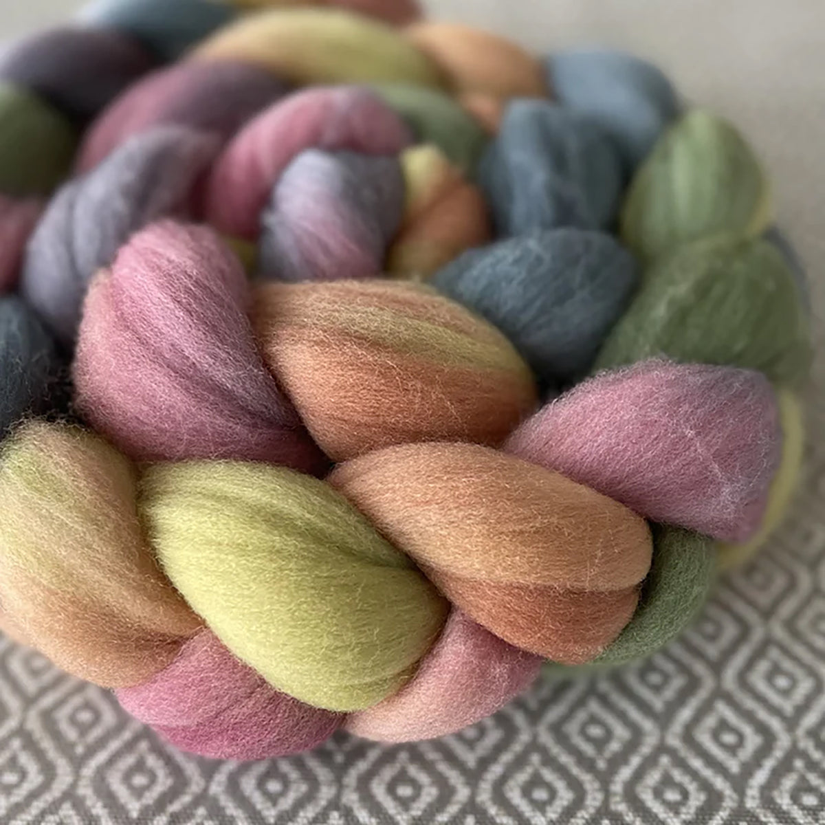 Detail of Greenwood Fiberworks Pigtails Jubilee in pastel colors of pink, yellow, orange, green, blue, and purple