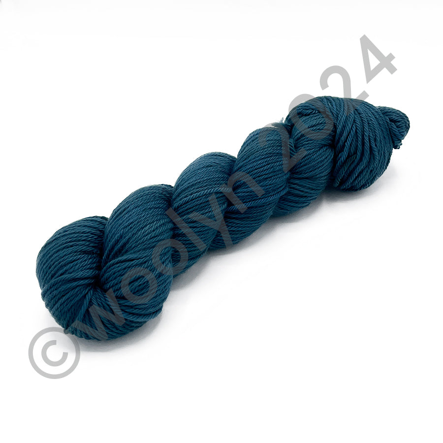 Skein of Tesserae Kissa in Nimue, a dark teal blue color