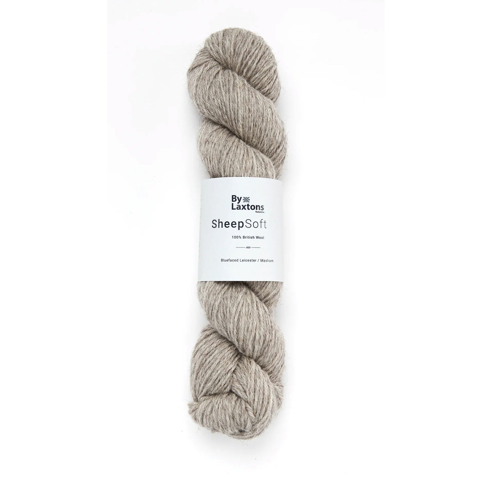 A skein of Coverdale, a heathered tan color on a white background