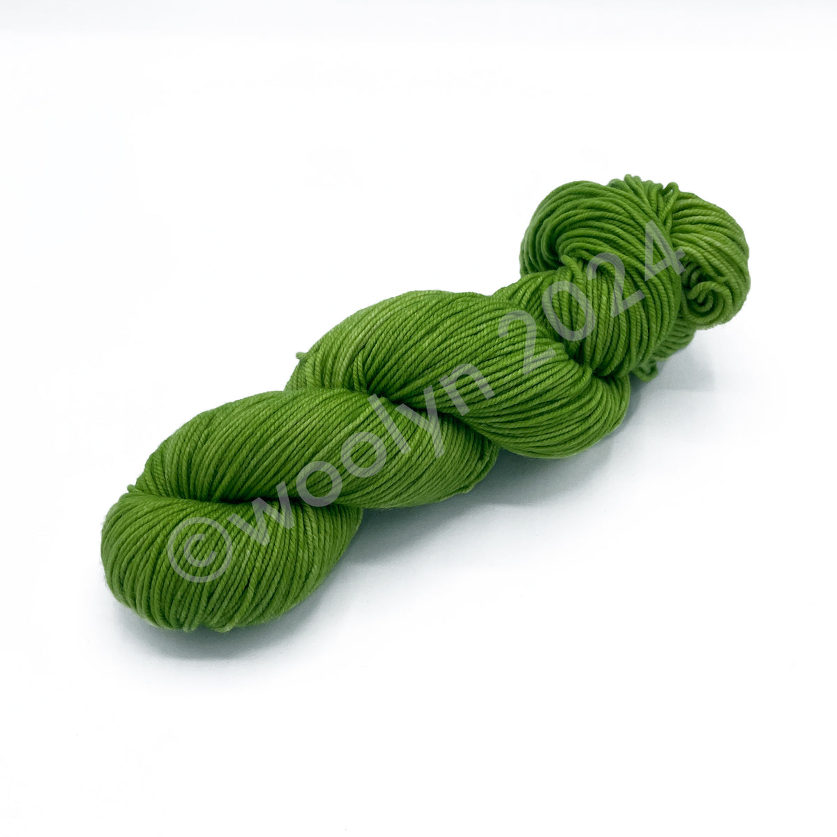 A Skein of Knitted Wit DK Spring Greem, a leaf green