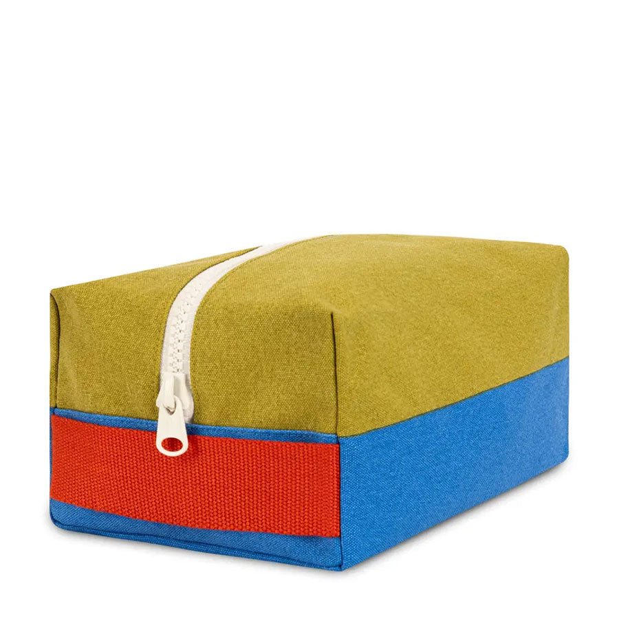 Rectangular fabric pouch in green blue and red with a zipper closure