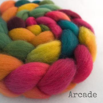 Detail of Greenwood Fiberworks Pigtails in Arcade, vibrant pinks, oranges, greens, yellows, and teal