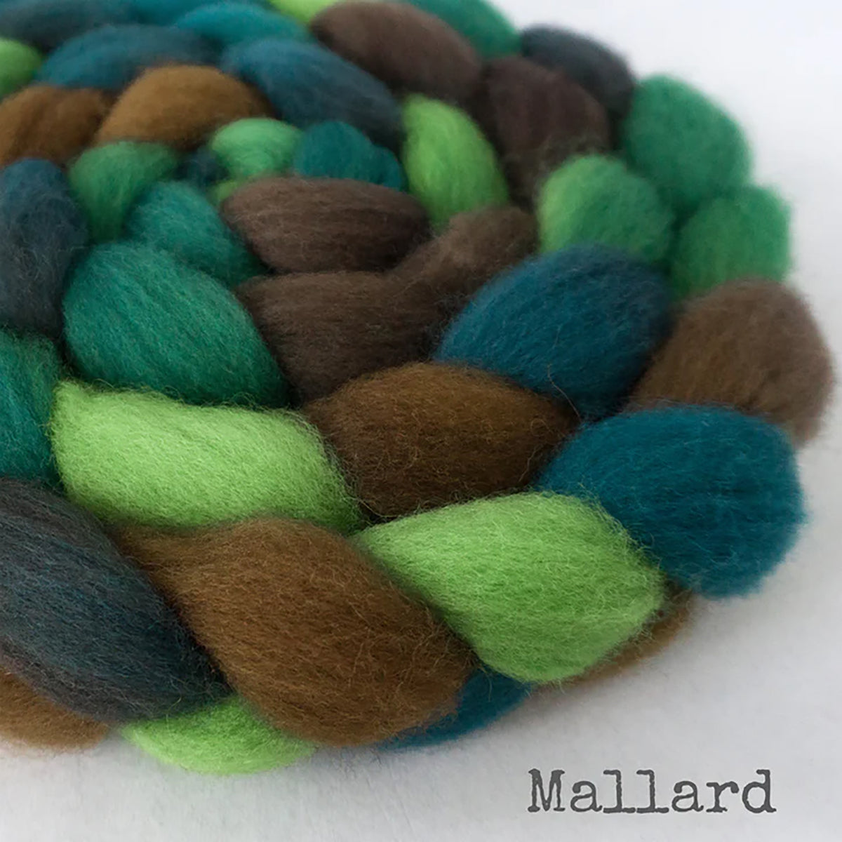 Detail of Greenwood Fiberworks Pigtails Mallard in colors lime green, emerald green, teal, and brown