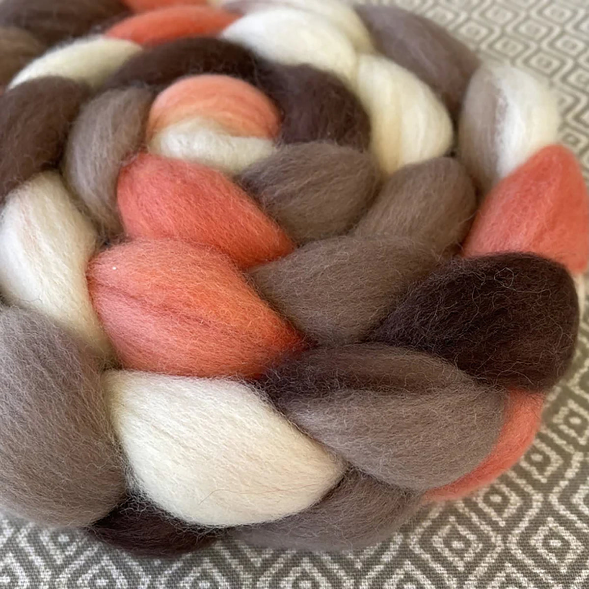 Detail of Greenwood Fiberworks Pigtails Retro Girl in colors white, dark brown, light pink, and sandy brown