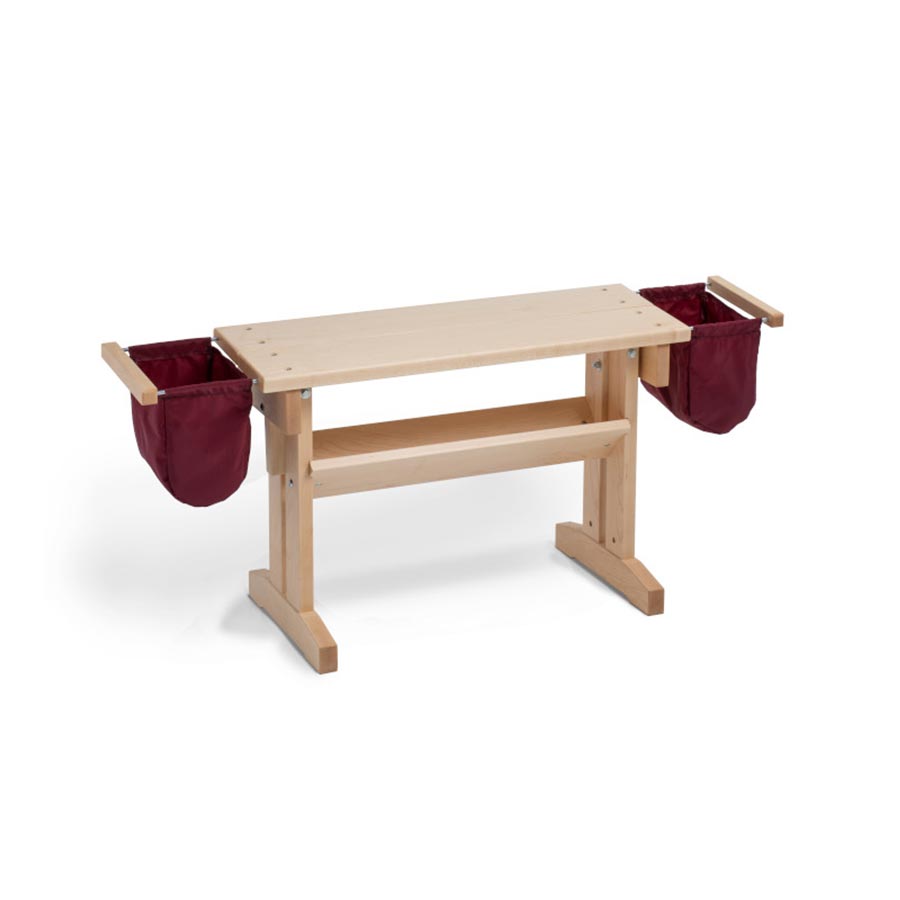 Image of a maple wood adjustable height Schacht Floor Loom Bench with add on red side bags.