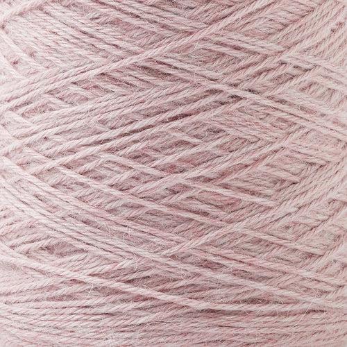 Detail of Gist Yarn Ode Blossom, a bright pink with grey undetones. 