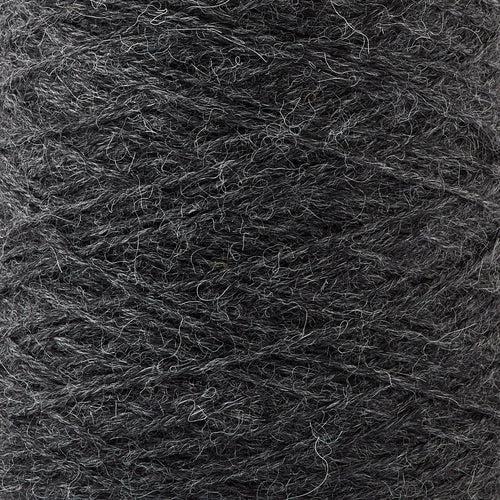 Detail of Gist Yarn Ode Shadow, a very dark charcoal grey.