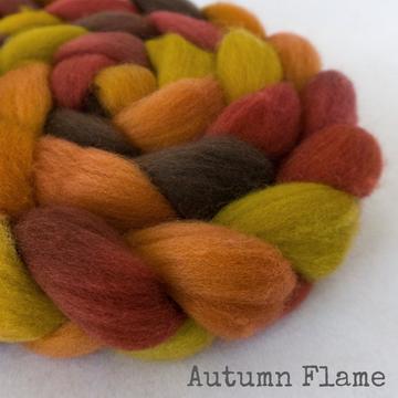 Detail of Greenwood Fiberworks Falkland Autumn Flame in chartruese, red, orange and brown.