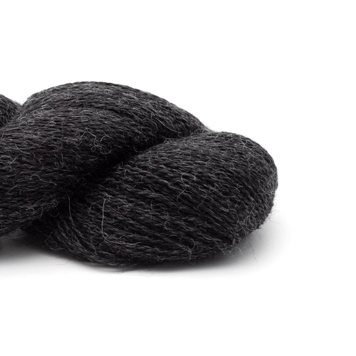 Detail of Kremke Baby Alpaca Lace in Anthracite, a heathered dark grey color