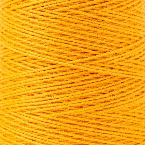 detail of Gist Yarn 3/2 Cotton in Dandelion, a bright orangey yellow.