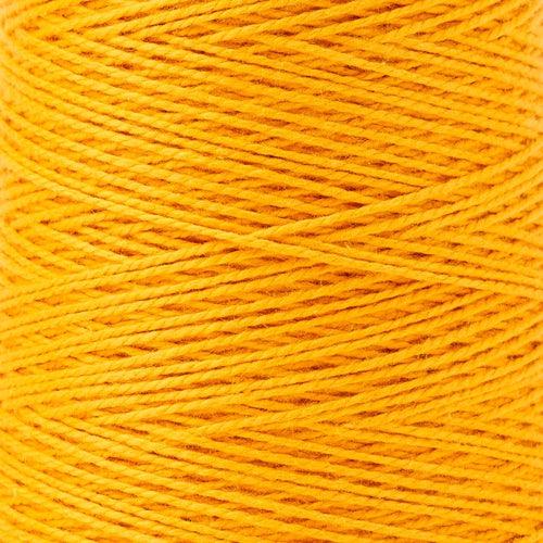 detail of Gist Yarn 3/2 Cotton in Dandelion, a bright orangey yellow.