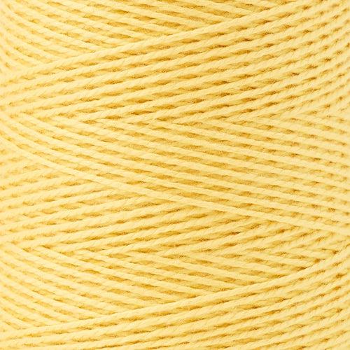 detail of Gist Yarn 3/2 Cotton in Lemon, a bright pale yellow. 
