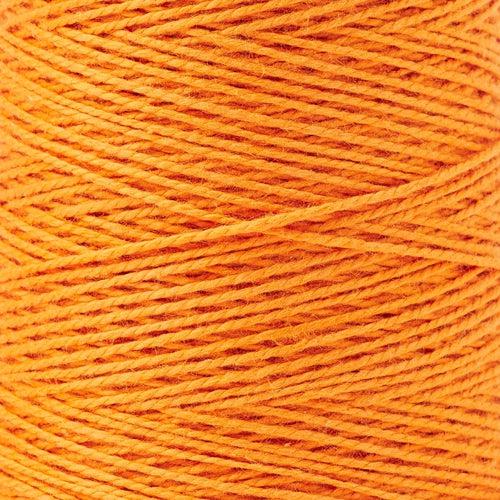detail of Gist Yarn 3/2 Cotton in Tangerine, a bright, medium yellowy orange.. 