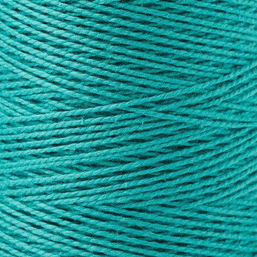 detail of Gist Yarn 3/2 Cotton in Jade, a bright, deep blue green. 