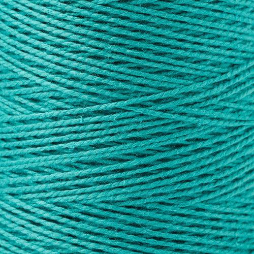 detail of Gist Yarn 3/2 Cotton in Jade, a bright, deep blue green. 