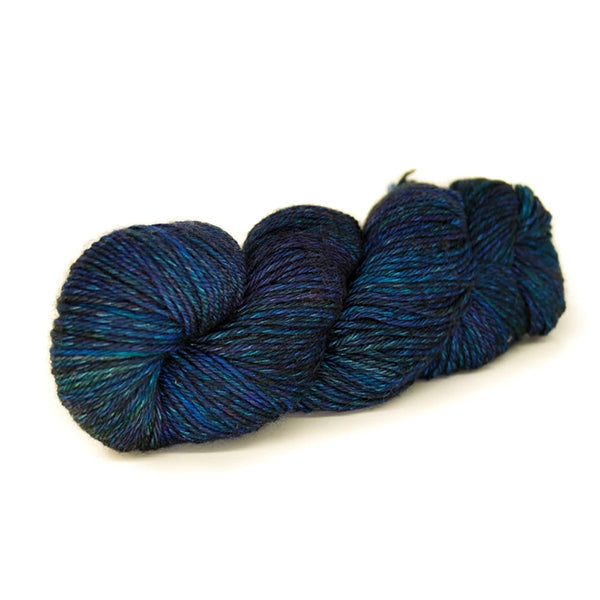 Laneras Deseos Bluegrass a gently variegated yarn of multiple shades of blue with hints of turquoise. 