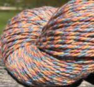 Detail of North Light Fibers Seaside Corn Cove, a marled yarn in muted red, orange and blue. 