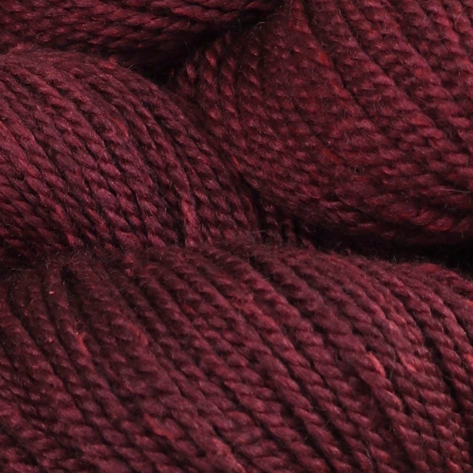 Detail image of The Fibre Co Acadia in Cranberry a heathered deep red..