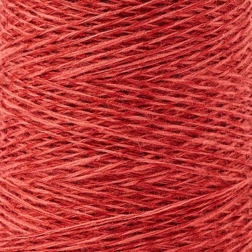 Detail of Gist Duet in Currant, a medium orange with pink and brown tones. 