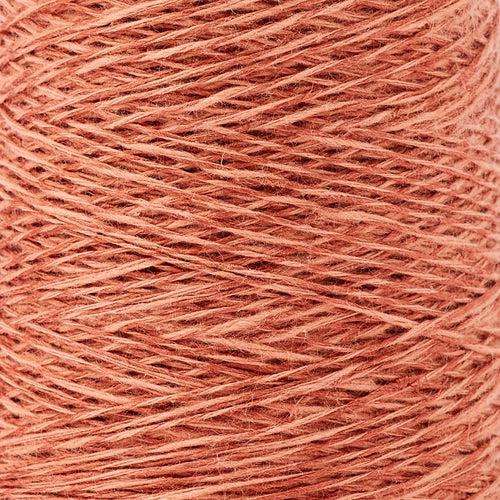 Detail of Gist Duet in Rust, a light brick red with pink tones.  