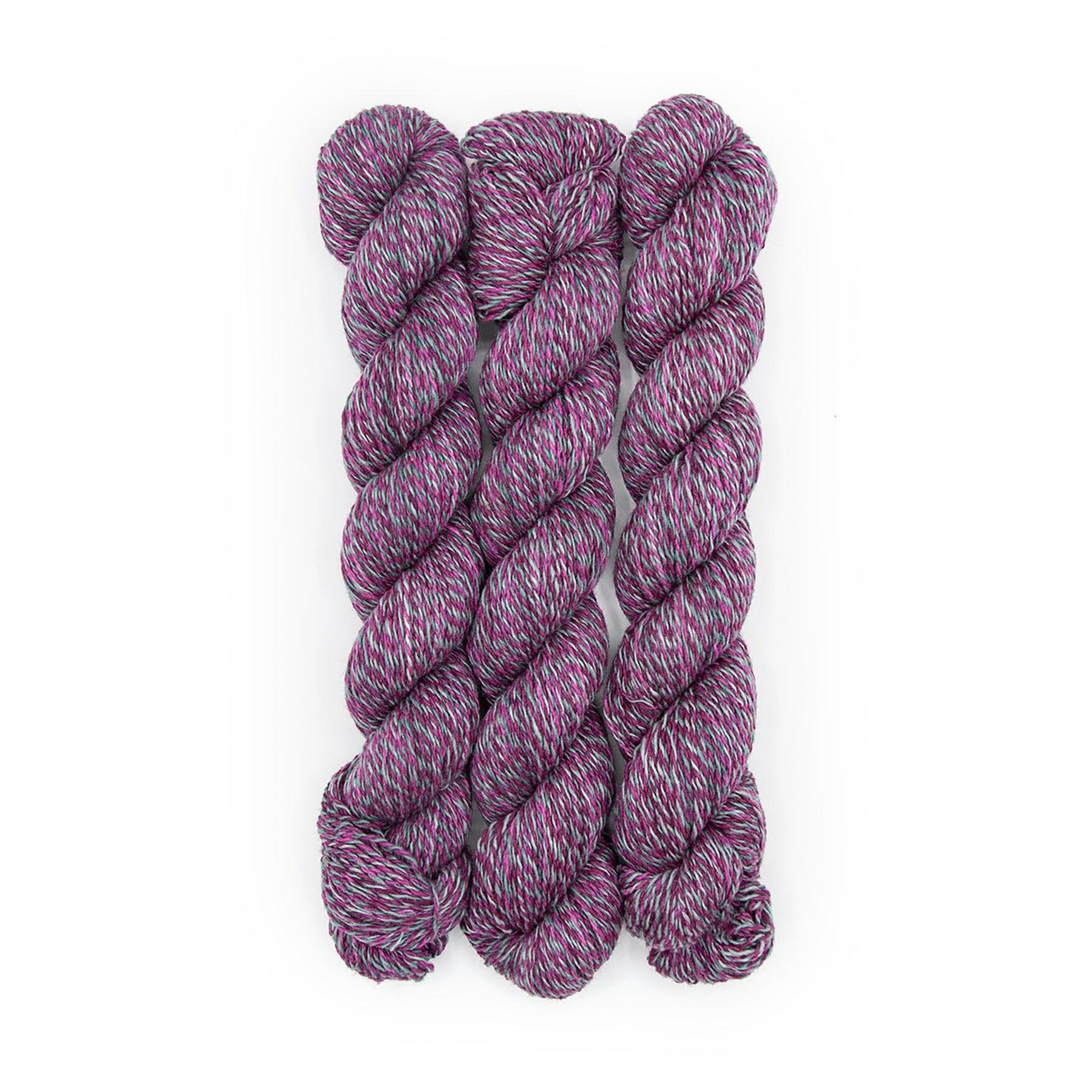 Plied Yarn North Ave Eubie Blake a marled yarn with grey, magenta and bright pink colors.