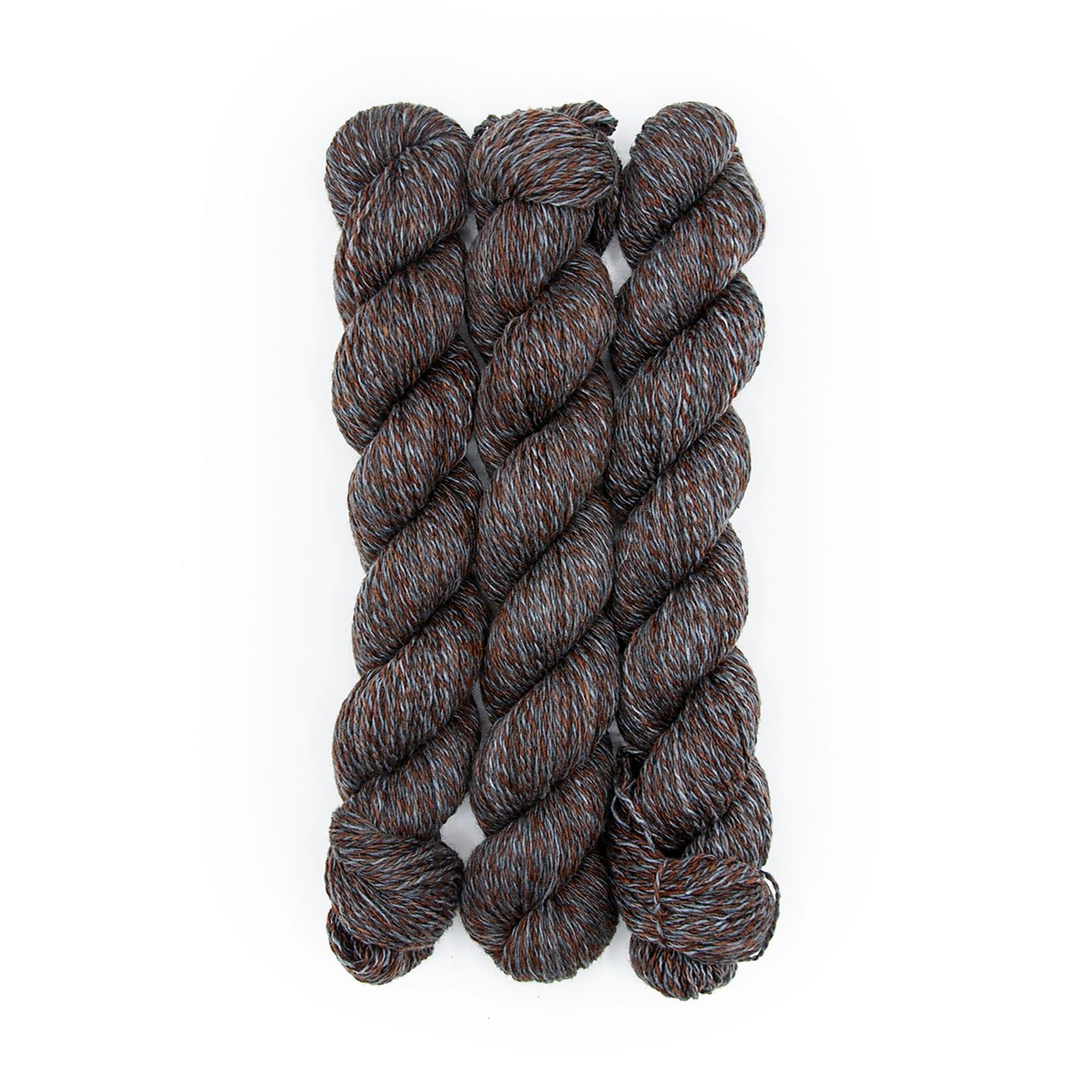Plied Yarn North Ave Great Blacks in Wax a marled yarn with grey, denim and dark brown colors.
