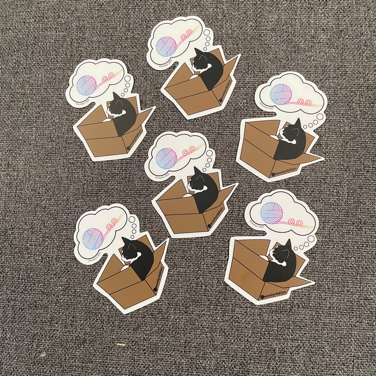 Nori is a sassy cat that often dreams of rainbow yarn. This sticker is the perfect addition to your computer, water bottle or yarn stash bin.