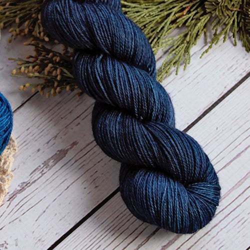Yarn Love Amy March in Into the Deep a solid navy color.