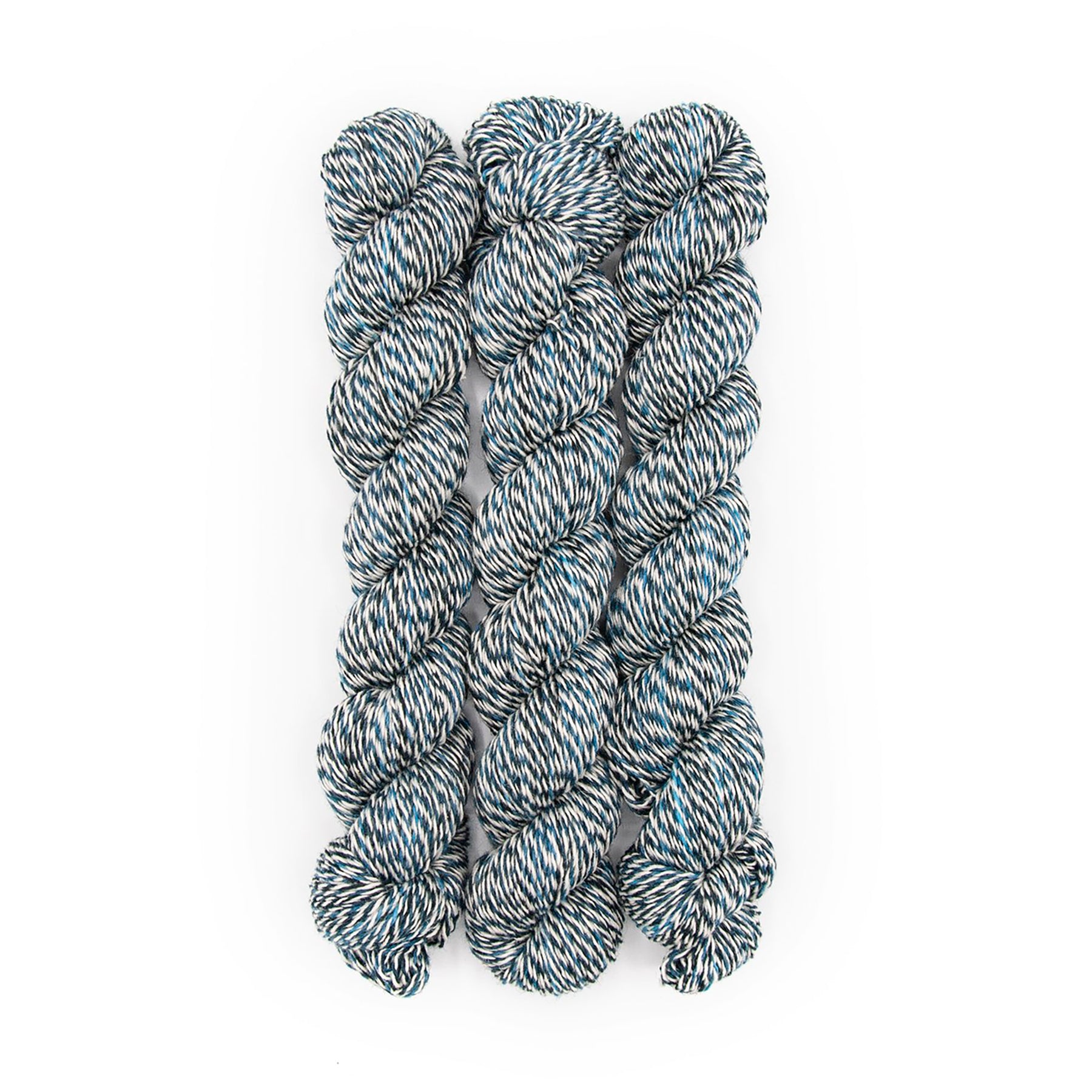 Plied Yarn North Ave Light Tower a marled yarn with white, black and bright blue colors.