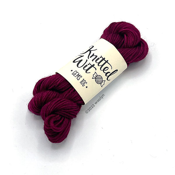 Knitted Wit Gems Madge a deep maroon color with purple undertones.