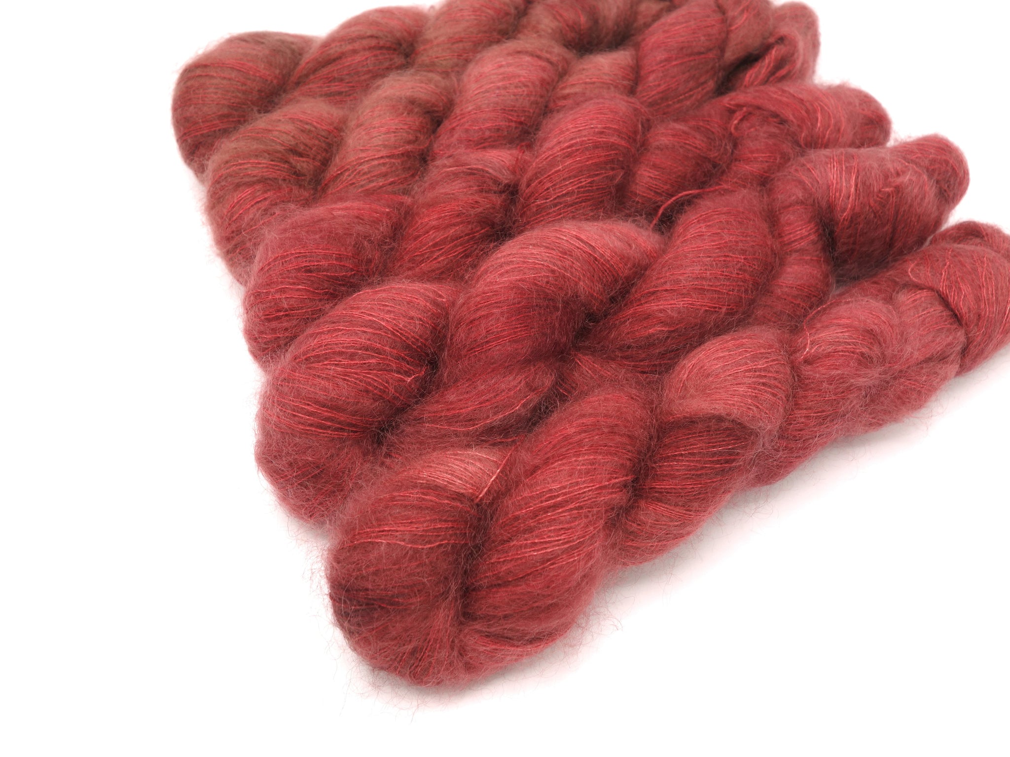 Skeins of Murky Depths Mirage Blood Oath, a red with hints of maroon.
