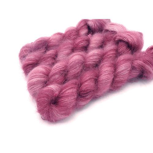 Skeins of Murky Depths Mirage Damask Rose, a bright rosy tonal pink.