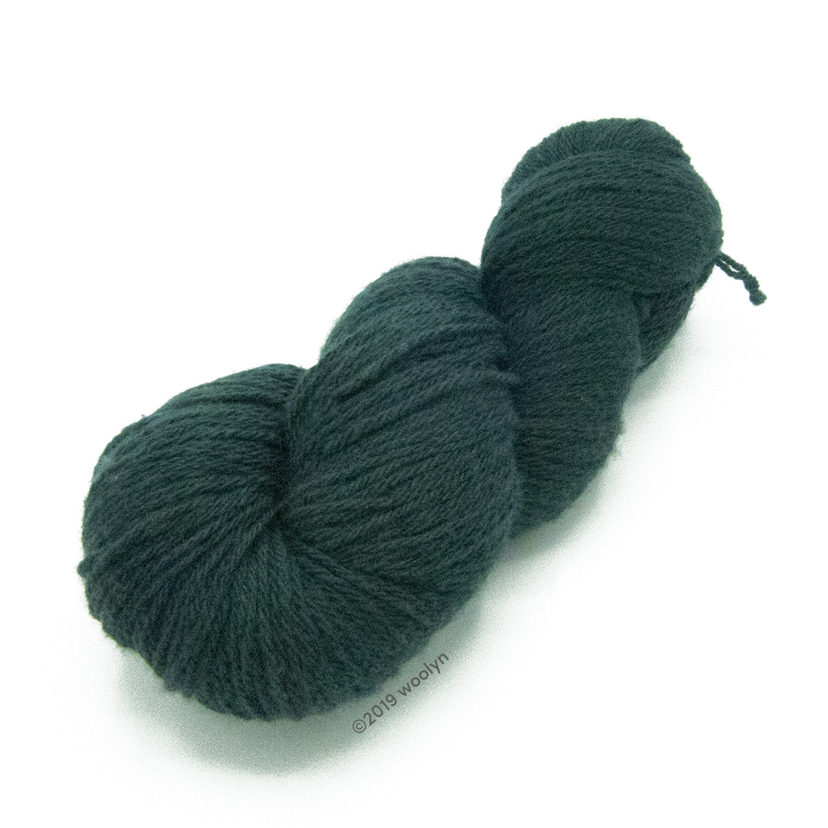 North Light Fibers Spring St in Spruce, a dark green color.
