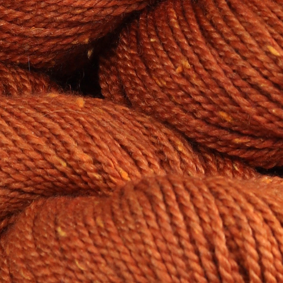 Detail image of The Fibre Co Acadia in Orange Storm, a heathered deep orange with light orange.