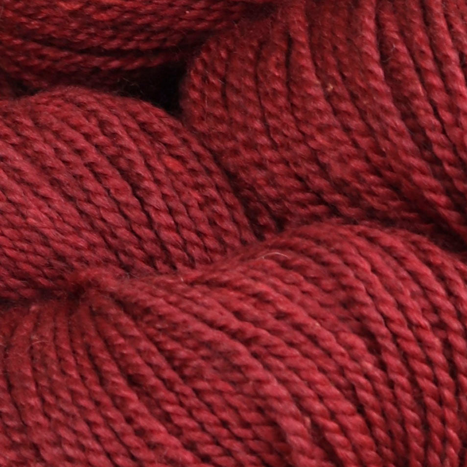 Detail image of The Fibre Co Acadia in Poppy, a heathered garnet red.