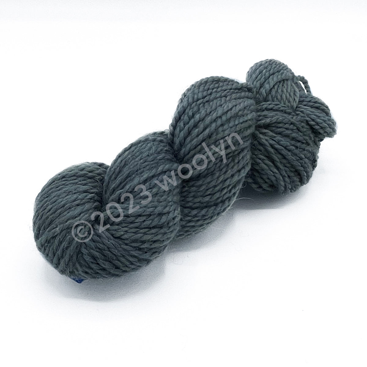A skein of Tesserae Chonky in Road Work Ahead, a cool grey color