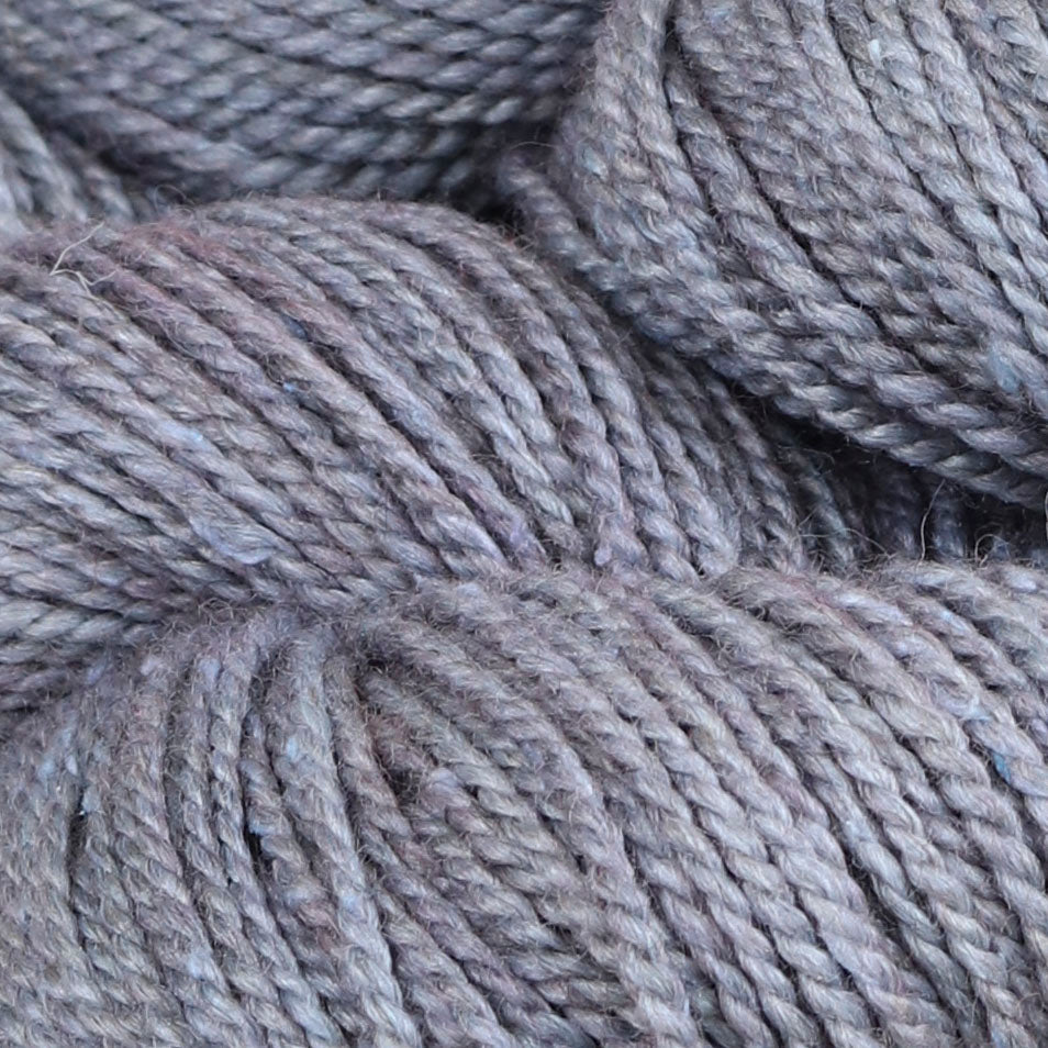 Detail image of The Fibre Co Acadia in Sea Lavender, a heathered dusty purple.