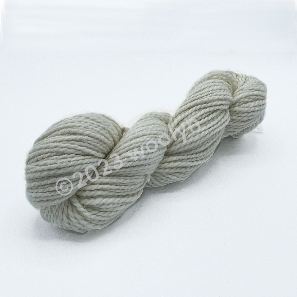 A skein of Tesserae Chonky in Sheep’s birthday suit, a natural off-white color