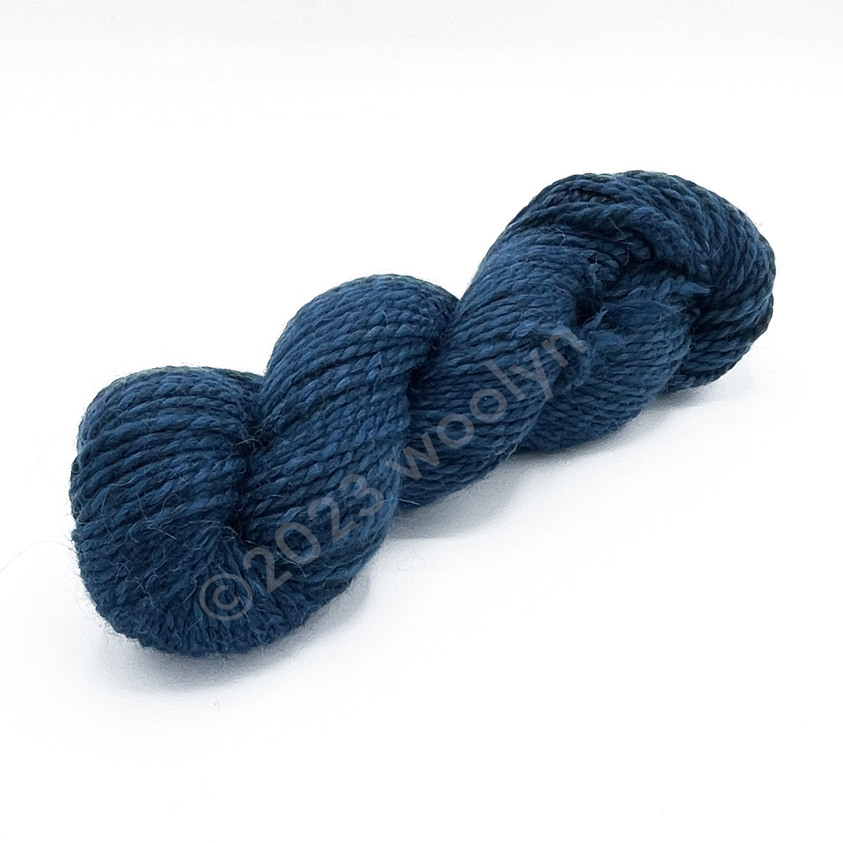 A skein of Tesserae Chonky in stormy skies, a dark blue color