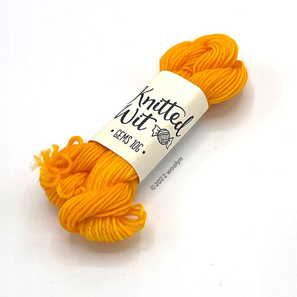 Knitted Wit Gems Sunshine a medium bright orange color.
